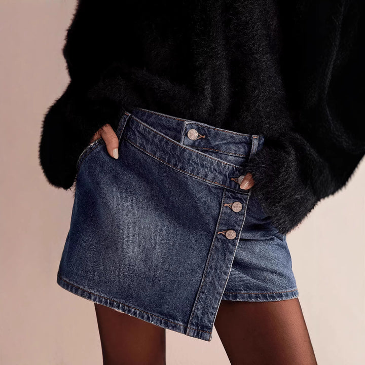 Damer modisch A-linjig denimkjol med asymmetrisk knapdesign och praktiska fickor Mirla-Eva Jonsson