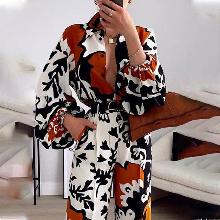 Damer modischer Jumpsuit med dramatiska puffärmar och bälte Mirla-Eva Jonsson