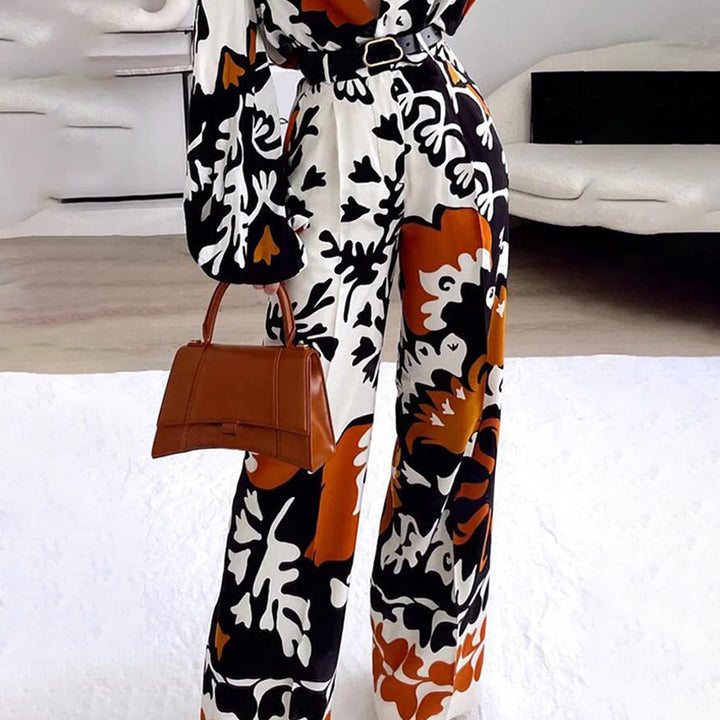 Damer modischer Jumpsuit med dramatiska puffärmar och bälte Mirla-Eva Jonsson