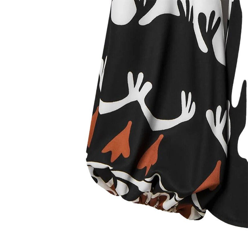 Damer modischer Jumpsuit med dramatiska puffärmar och bälte Mirla-Eva Jonsson