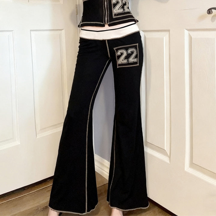 Damer modisk bootcut-byxa med elastisk midja och sportiga applikationer Mirla-Eva Jonsson