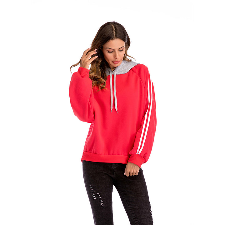 Damer modisk hoodie med kontrasterande ärmar och avslappnad passform Mirla-Eva Jonsson