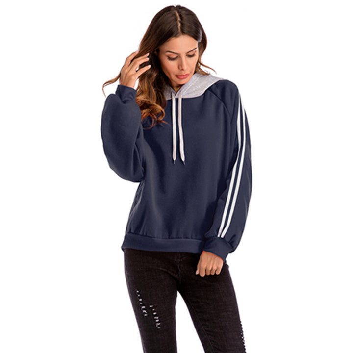 Damer modisk hoodie med kontrasterande ärmar och avslappnad passform Mirla-Eva Jonsson