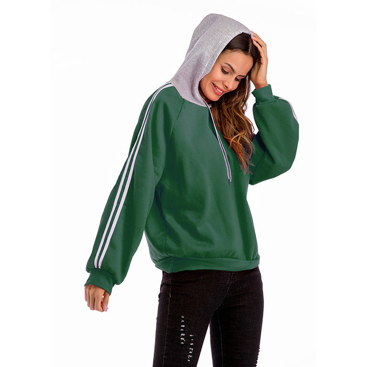 Damer modisk hoodie med kontrasterande ärmar och avslappnad passform Mirla-Eva Jonsson