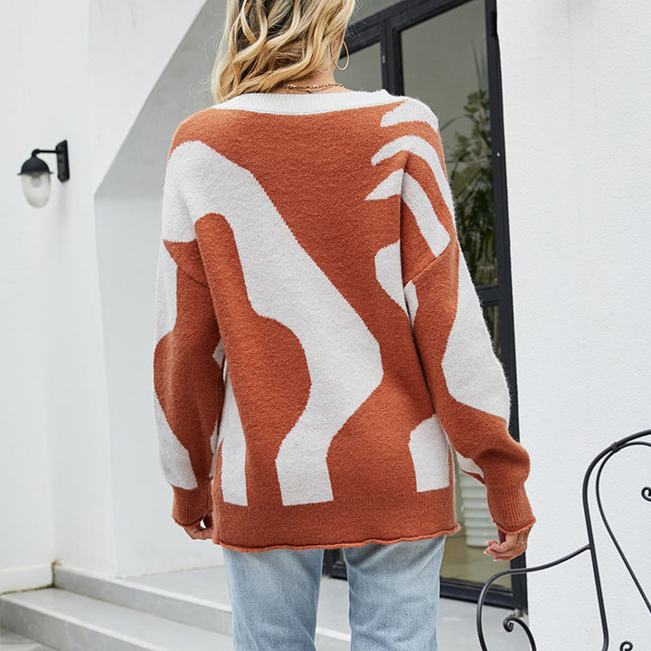Damer mysig oversized tröja med knapppdetaljer och kreativt mönster Mirla-Eva Jonsson