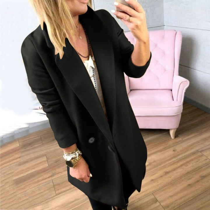Damer överlång, figursydd kappa med elegant slag och praktiska fickor Mirla-Eva Jonsson