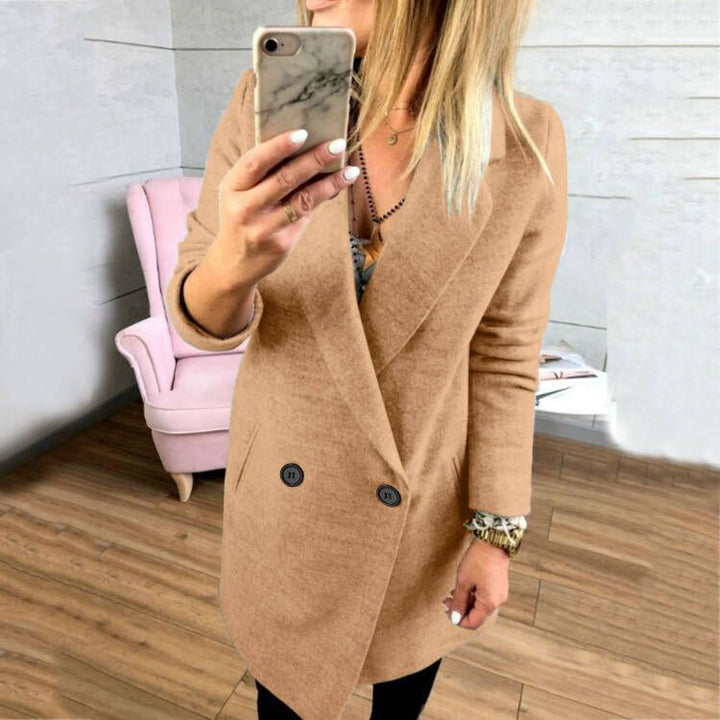 Damer överlång, figursydd kappa med elegant slag och praktiska fickor Mirla-Eva Jonsson