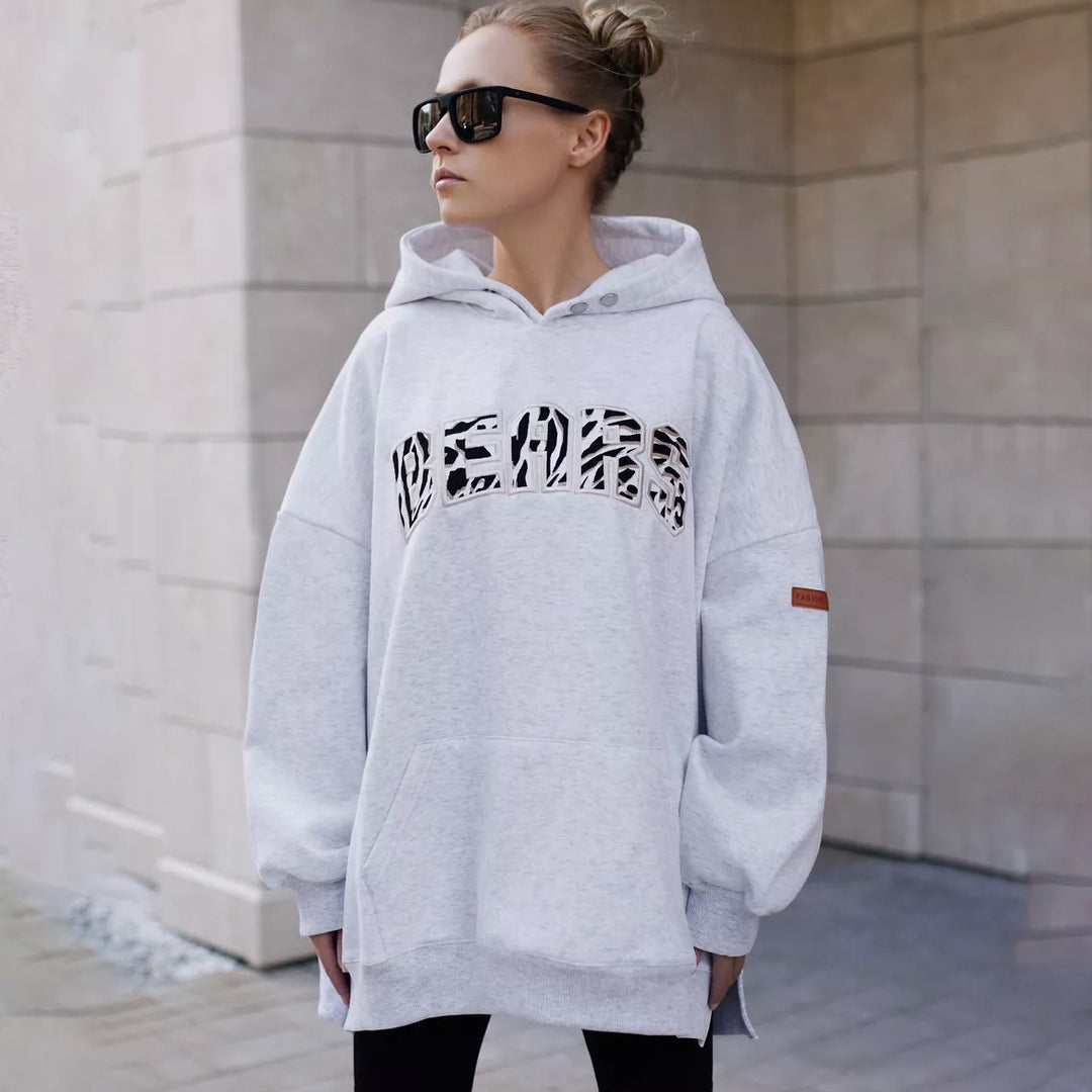 Damer oversized hoodie med kreativ grafisk design Mirla-Eva Jonsson