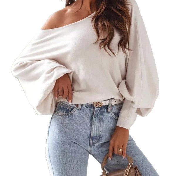 Damer oversized pullover med asymmetrisk skärning och djup halsringning Mirla-Eva Jonsson