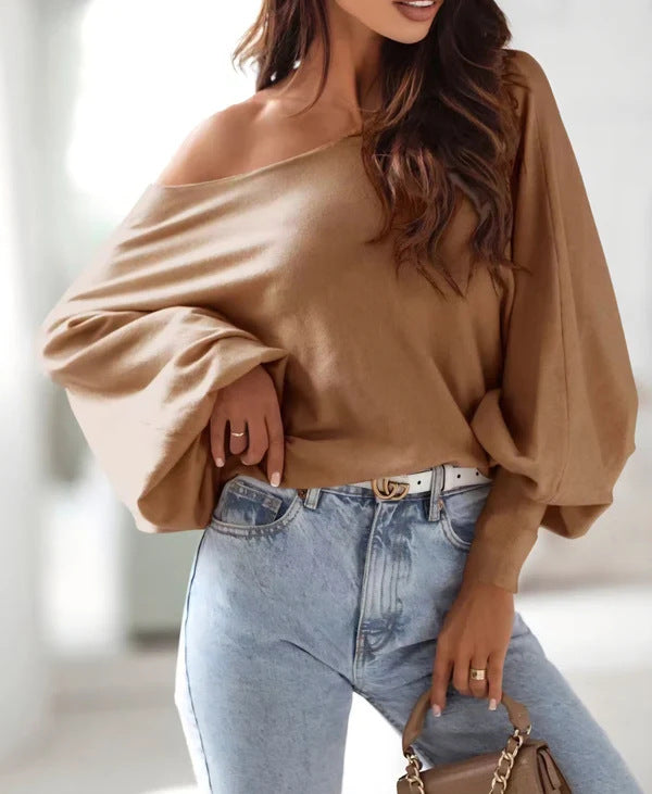 Damer oversized pullover med asymmetrisk skärning och djup halsringning Mirla-Eva Jonsson