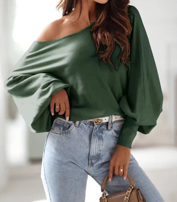 Damer oversized pullover med asymmetrisk skärning och djup halsringning Mirla-Eva Jonsson