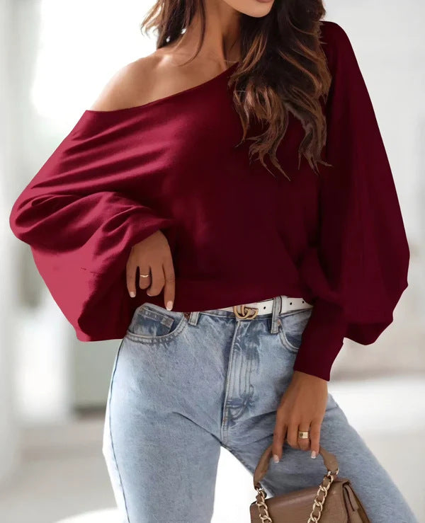 Damer oversized pullover med asymmetrisk skärning och djup halsringning Mirla-Eva Jonsson