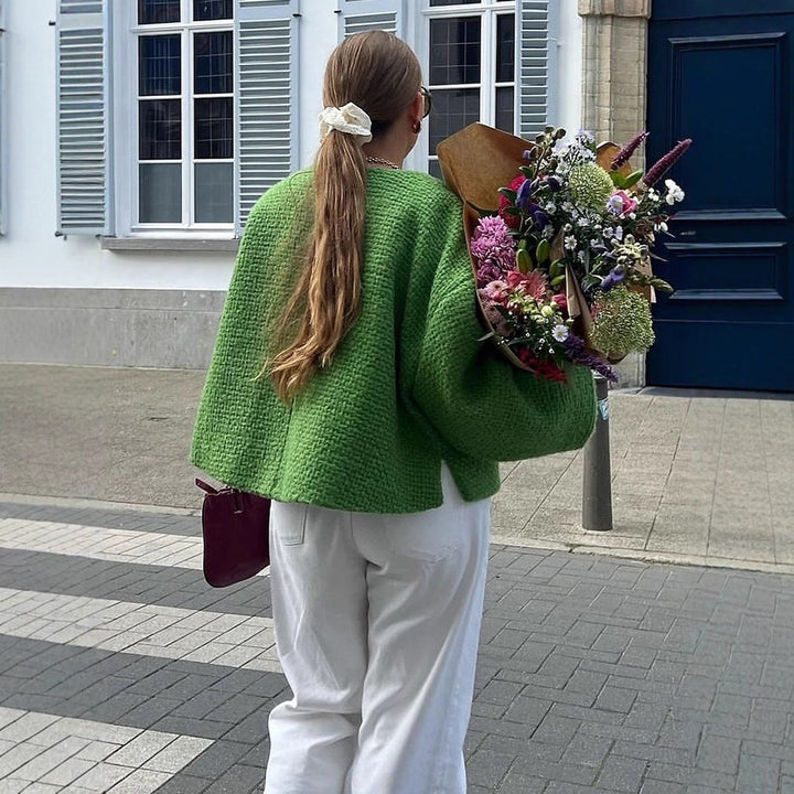 Damer oversized stickad jacka med dekorativt knyt-detail Mirla-Eva Jonsson