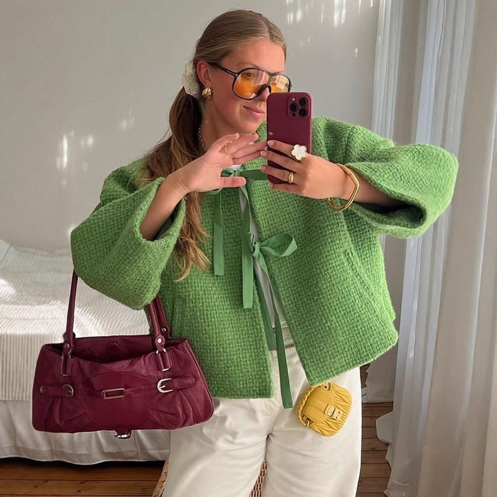 Damer oversized stickad jacka med dekorativt knyt-detail Mirla-Eva Jonsson