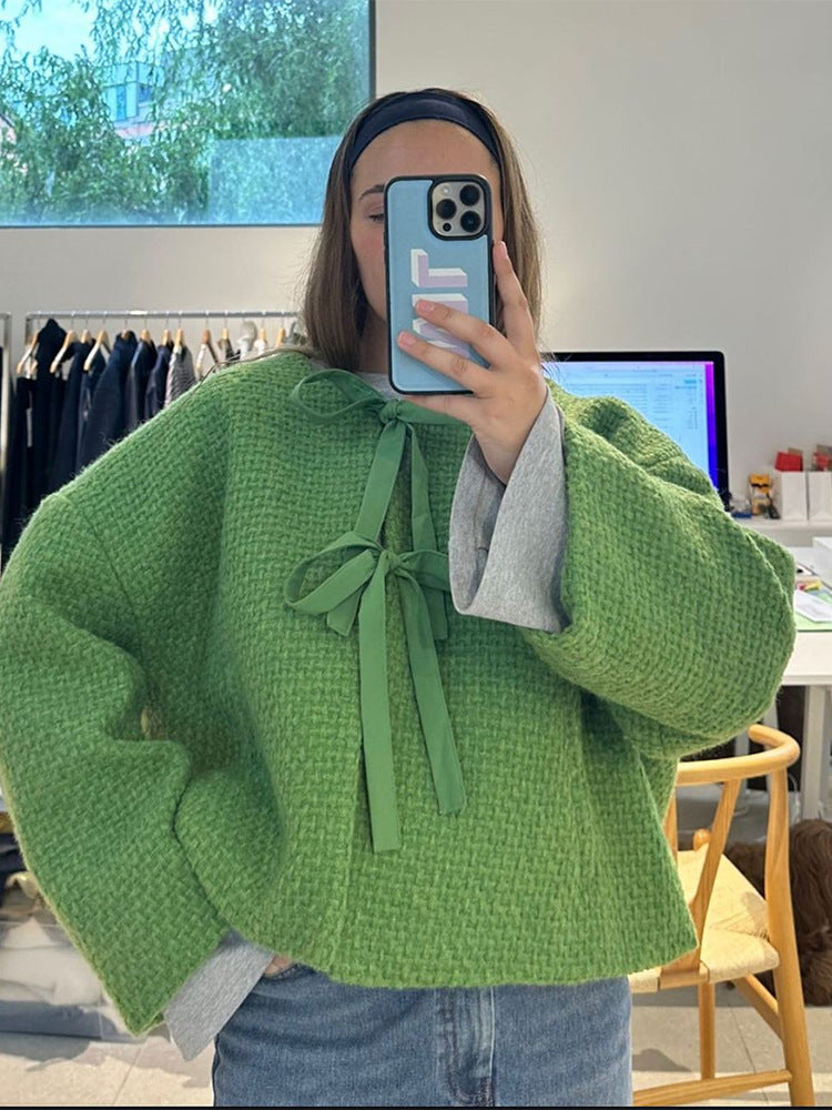 Damer oversized stickad jacka med dekorativt knyt-detail Mirla-Eva Jonsson