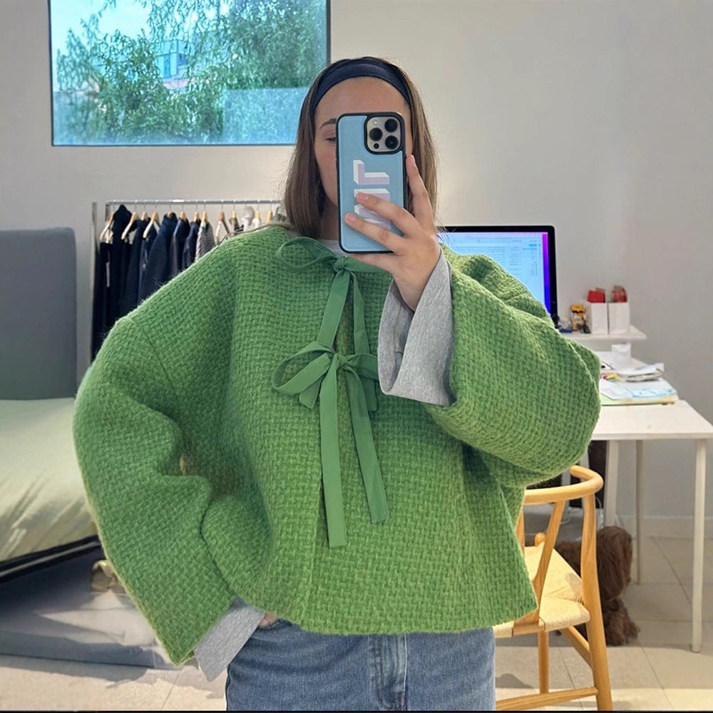 Damer oversized stickad jacka med dekorativt knyt-detail Mirla-Eva Jonsson