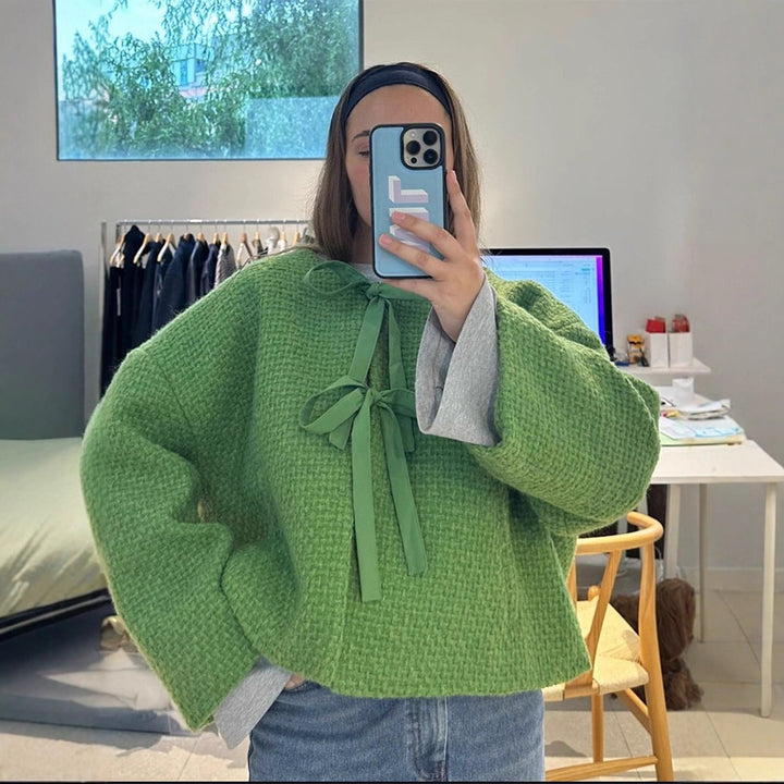 Damer oversized stickad jacka med dekorativt knyt-detail Mirla-Eva Jonsson