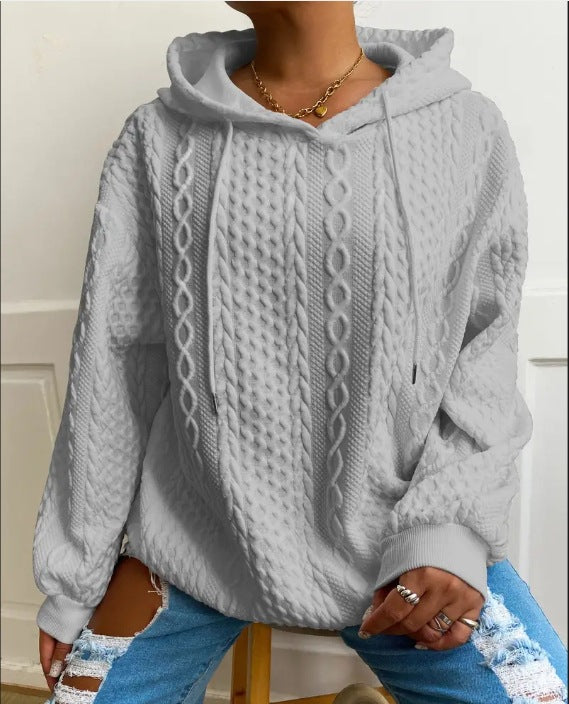 Damer oversized stickad tröja med kreativ kabel effekt och huva Mirla-Eva Jonsson