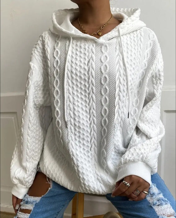 Damer oversized stickad tröja med kreativ kabel effekt och huva Mirla-Eva Jonsson