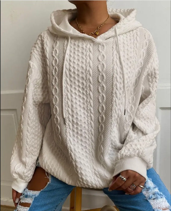 Damer oversized stickad tröja med kreativ kabel effekt och huva Mirla-Eva Jonsson