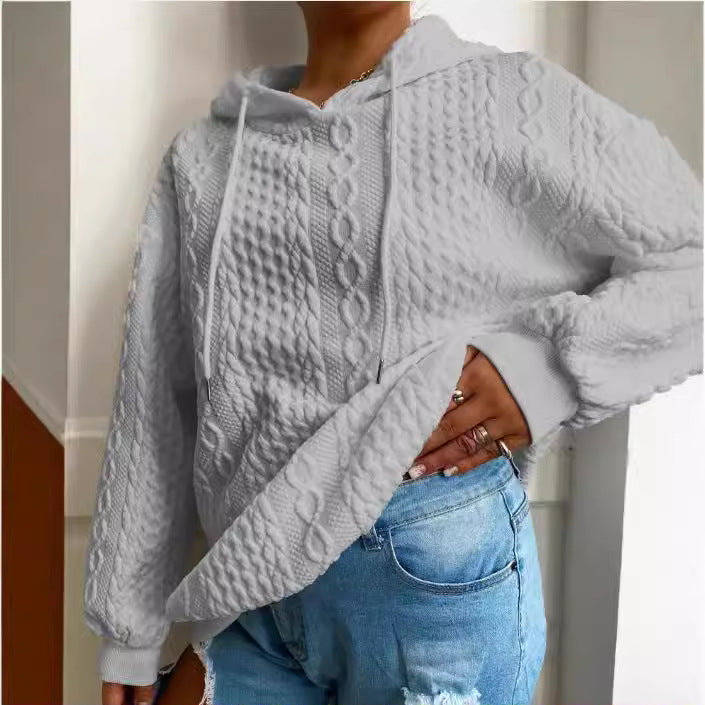 Damer oversized stickad tröja med kreativ kabel effekt och huva Mirla-Eva Jonsson