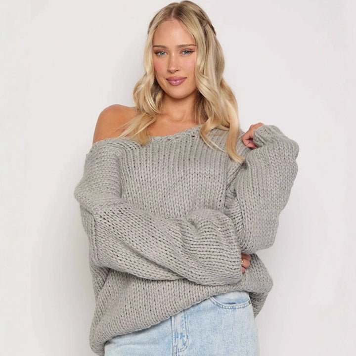 Damer oversized stickad tröja med öppna axlar och voluminösa ärmar Mirla-Eva Jonsson