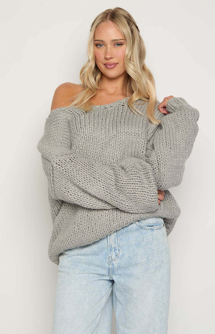 Damer oversized stickad tröja med öppna axlar och voluminösa ärmar Mirla-Eva Jonsson