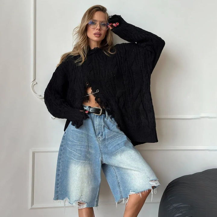 Damer oversized stickad tröja med raffinerad utskärning Mirla-Eva Jonsson