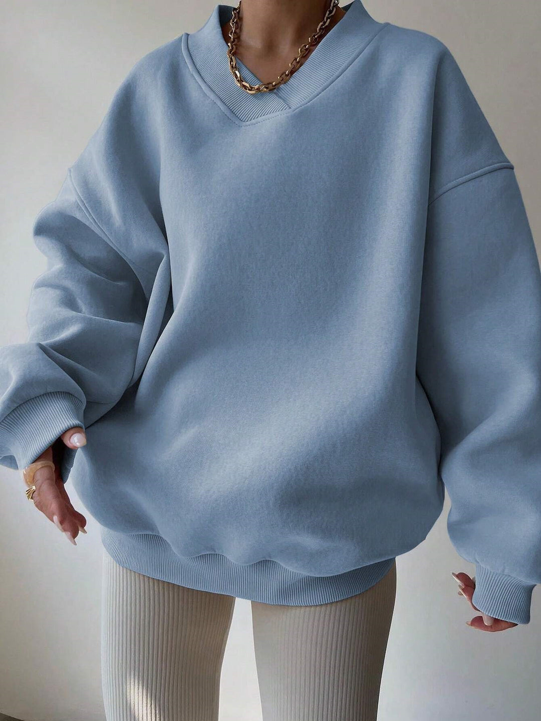 Damer oversized sweatshirt med V-hals Mirla-Eva Jonsson