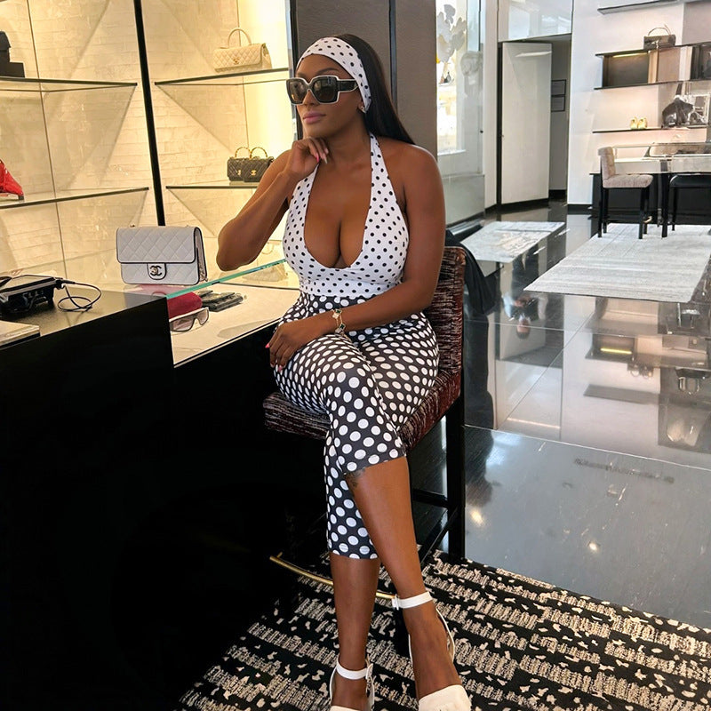Damer polka-dot jumpsuit med djup V-halsringning och elastiskt material Mirla-Eva Jonsson