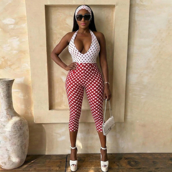 Damer polka-dot jumpsuit med djup V-halsringning och elastiskt material Mirla-Eva Jonsson