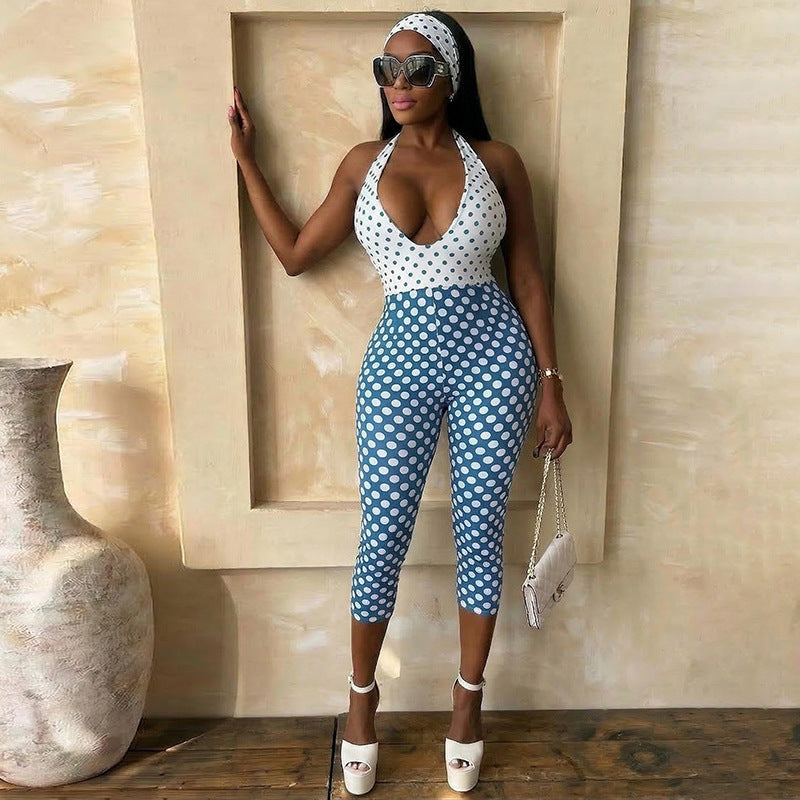 Damer polka-dot jumpsuit med djup V-halsringning och elastiskt material Mirla-Eva Jonsson