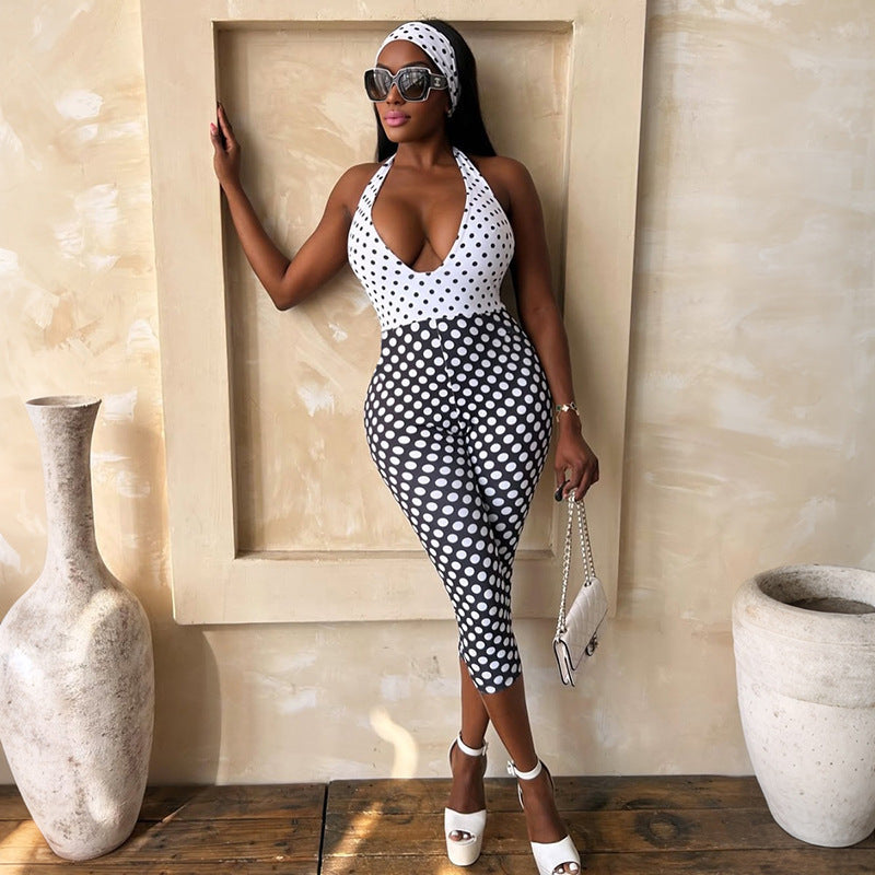 Damer polka-dot jumpsuit med djup V-halsringning och elastiskt material Mirla-Eva Jonsson
