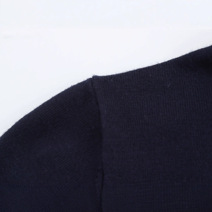 Damer polokrage tröja med eleganta knapdetails Mirla-Eva Jonsson