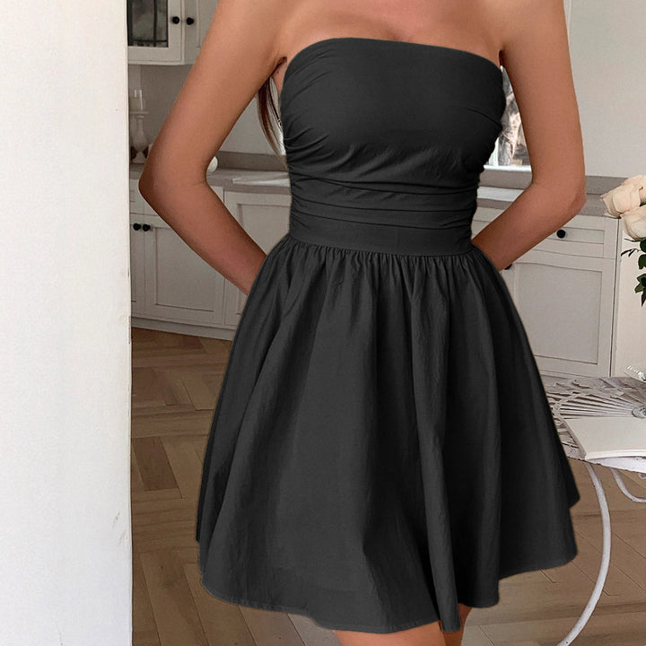 Damer sommaravslutningsklänning med off-shoulder design och flödande kjol Mirla-Eva Jonsson