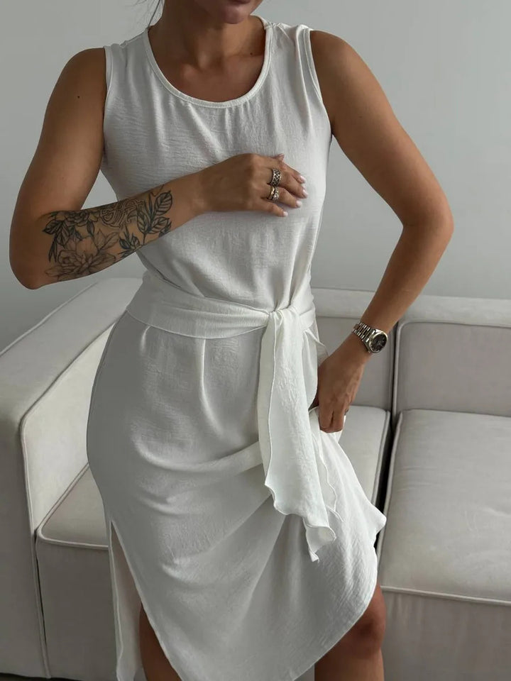Damer sommarinspirerad omlottklänning med sidoflik och figursydd design Mirla-Eva Jonsson