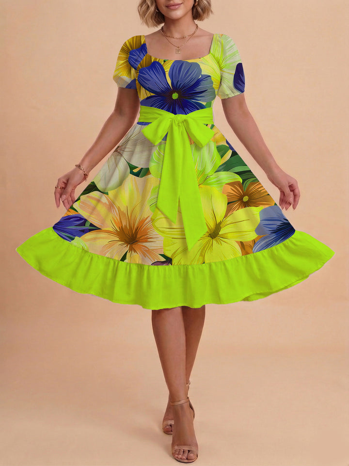 Damer sommarklänning med floral puffärm och midjejusterbart bälte Mirla-Eva Jonsson