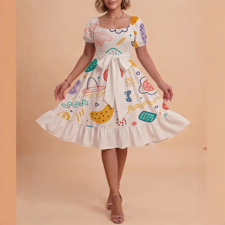 Damer sommarklänning med floral puffärm och midjejusterbart bälte Mirla-Eva Jonsson