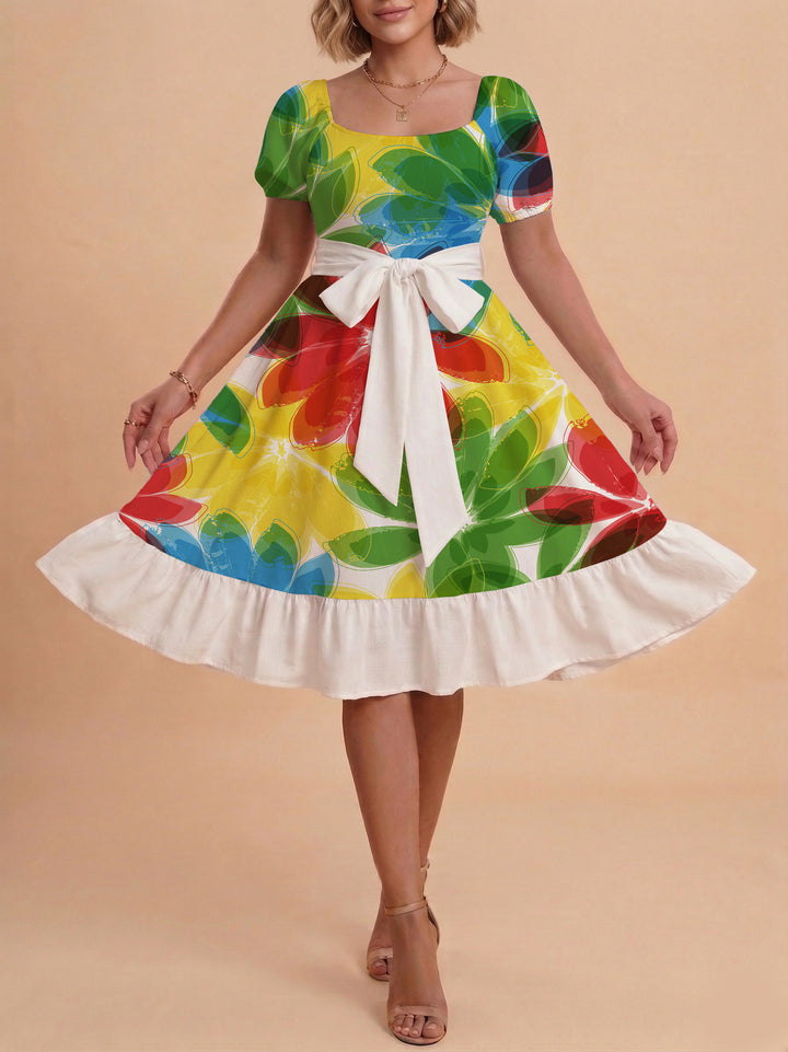 Damer sommarklänning med floral puffärm och midjejusterbart bälte Mirla-Eva Jonsson