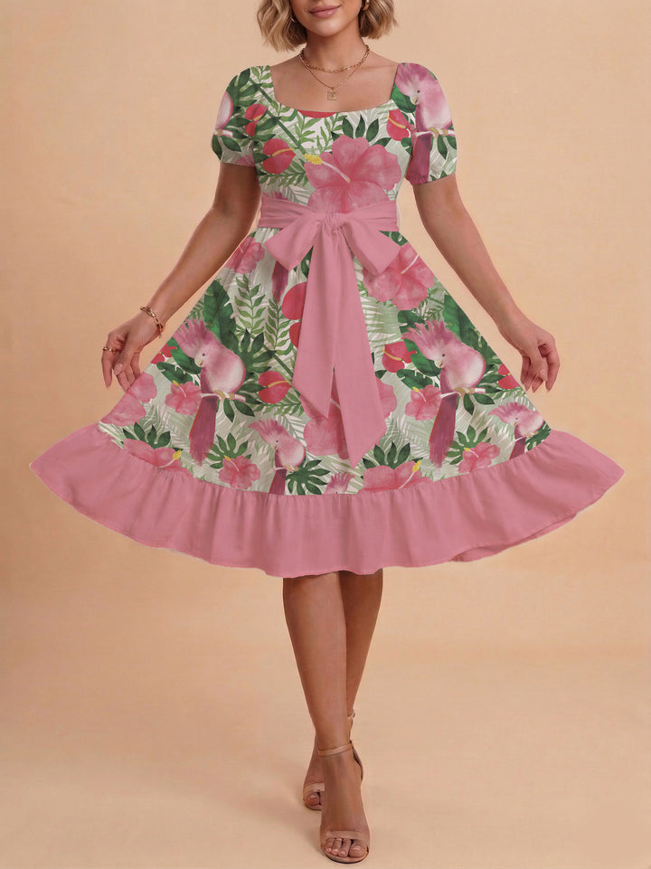 Damer sommarklänning med floral puffärm och midjejusterbart bälte Mirla-Eva Jonsson