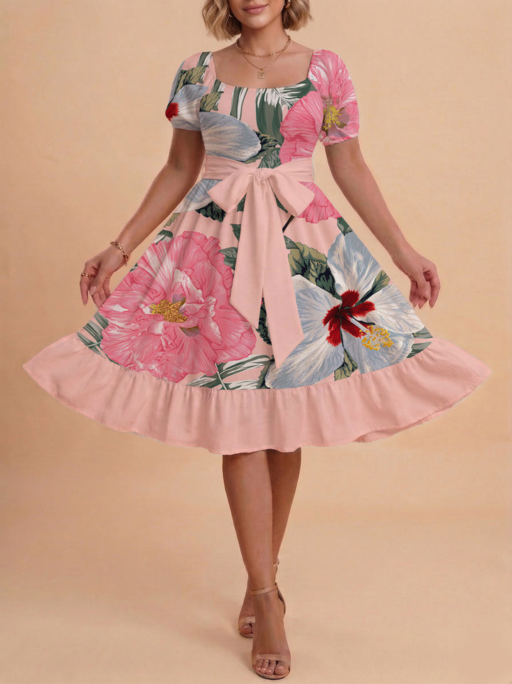 Damer sommarklänning med floral puffärm och midjejusterbart bälte Mirla-Eva Jonsson