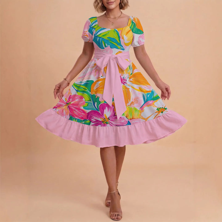 Damer sommarklänning med floral puffärm och midjejusterbart bälte Mirla-Eva Jonsson