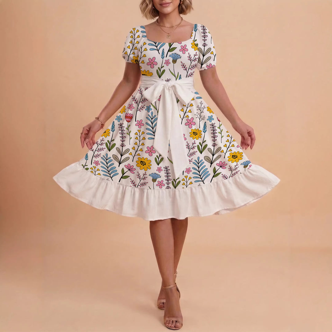 Damer sommarklänning med floral puffärm och midjejusterbart bälte Mirla-Eva Jonsson