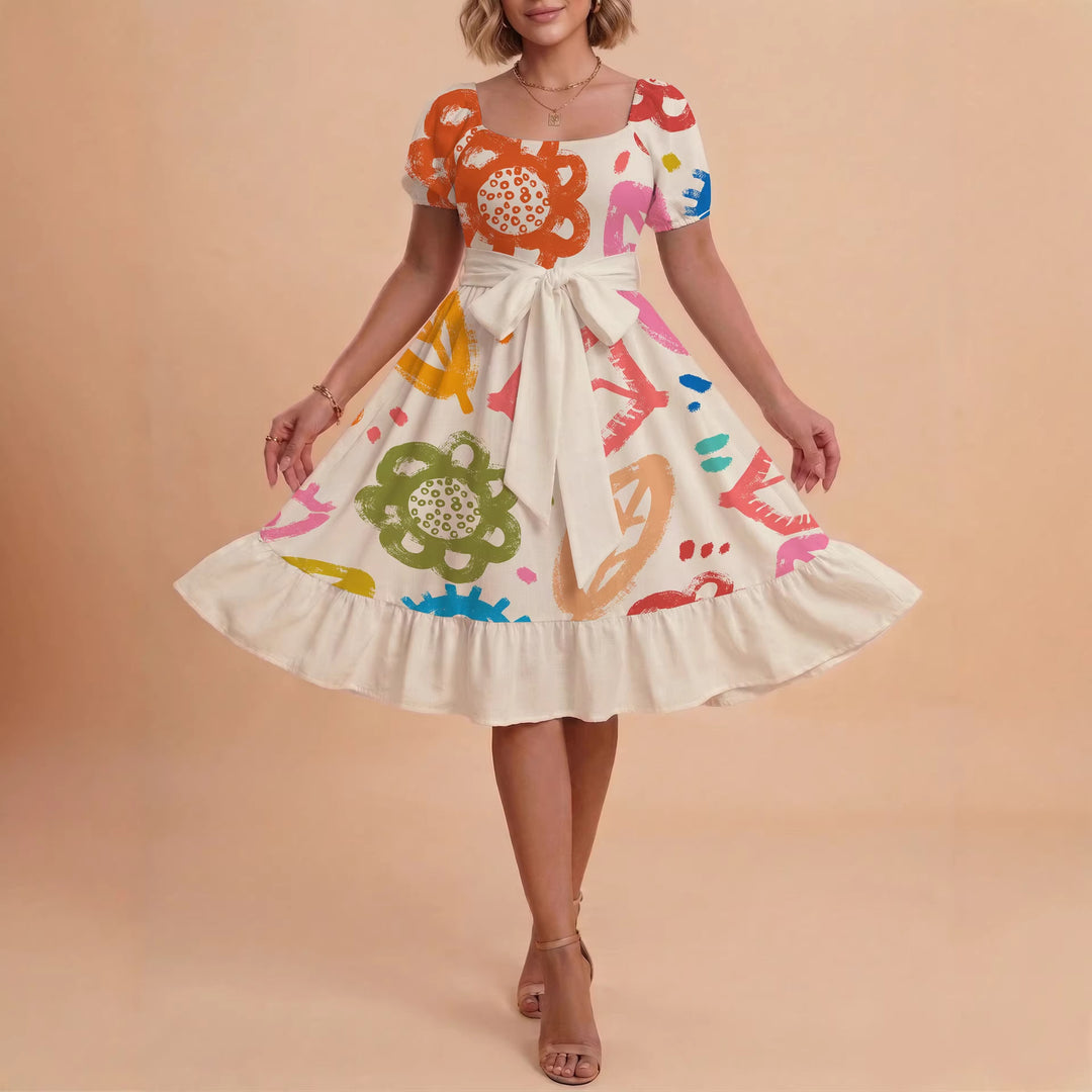 Damer sommarklänning med floral puffärm och midjejusterbart bälte Mirla-Eva Jonsson