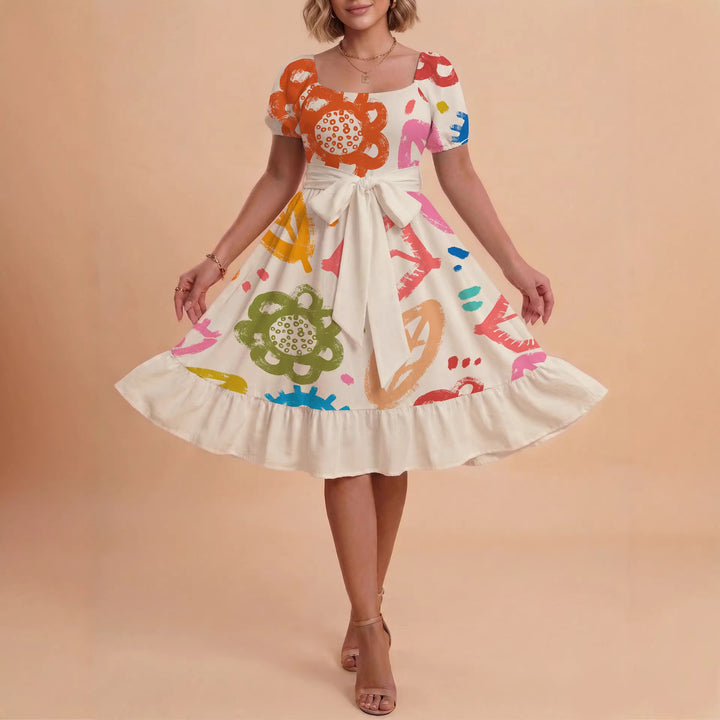 Damer sommarklänning med floral puffärm och midjejusterbart bälte Mirla-Eva Jonsson