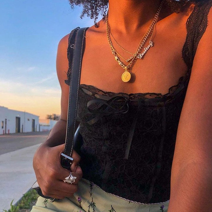 Damer spets-crop-top med dekorativa band och fina detaljer Mirla-Eva Jonsson