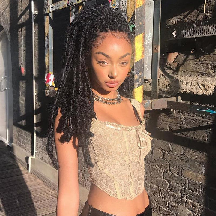 Damer spets-crop-top med dekorativa band och fina detaljer Mirla-Eva Jonsson