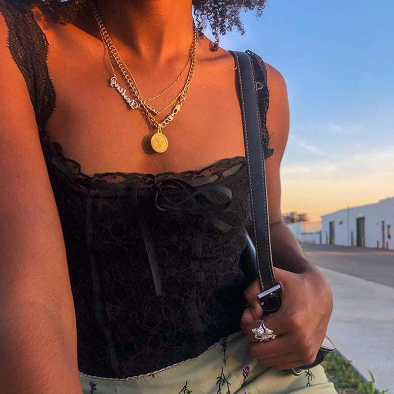 Damer spets-crop-top med dekorativa band och fina detaljer Mirla-Eva Jonsson
