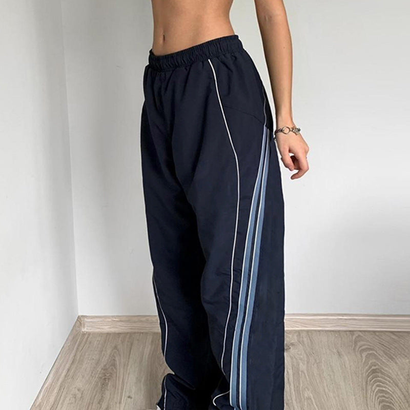Damer sportbyxor med hög elastisk midja och sidokontrastlinjer Mirla-Eva Jonsson