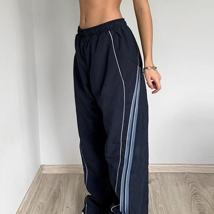 Damer sportbyxor med hög elastisk midja och sidokontrastlinjer Mirla-Eva Jonsson
